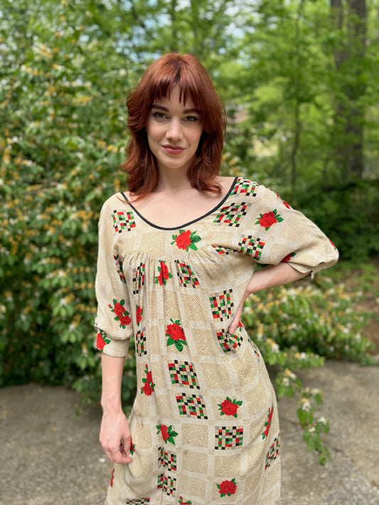Close-up of the top half showing the bodice, black crocheted detail and the rose geometric print