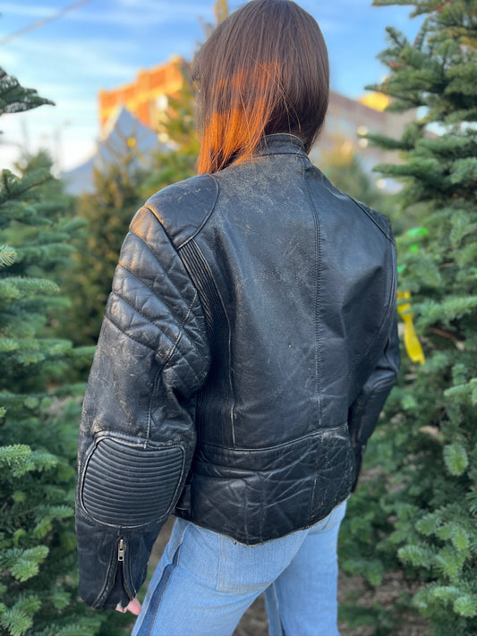Back view on the model showing the padded shoulders and sleeves