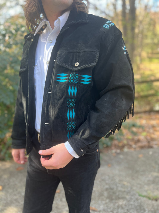Close-up on the model of the beaded design on the front, a flap pocket and shoulder beading