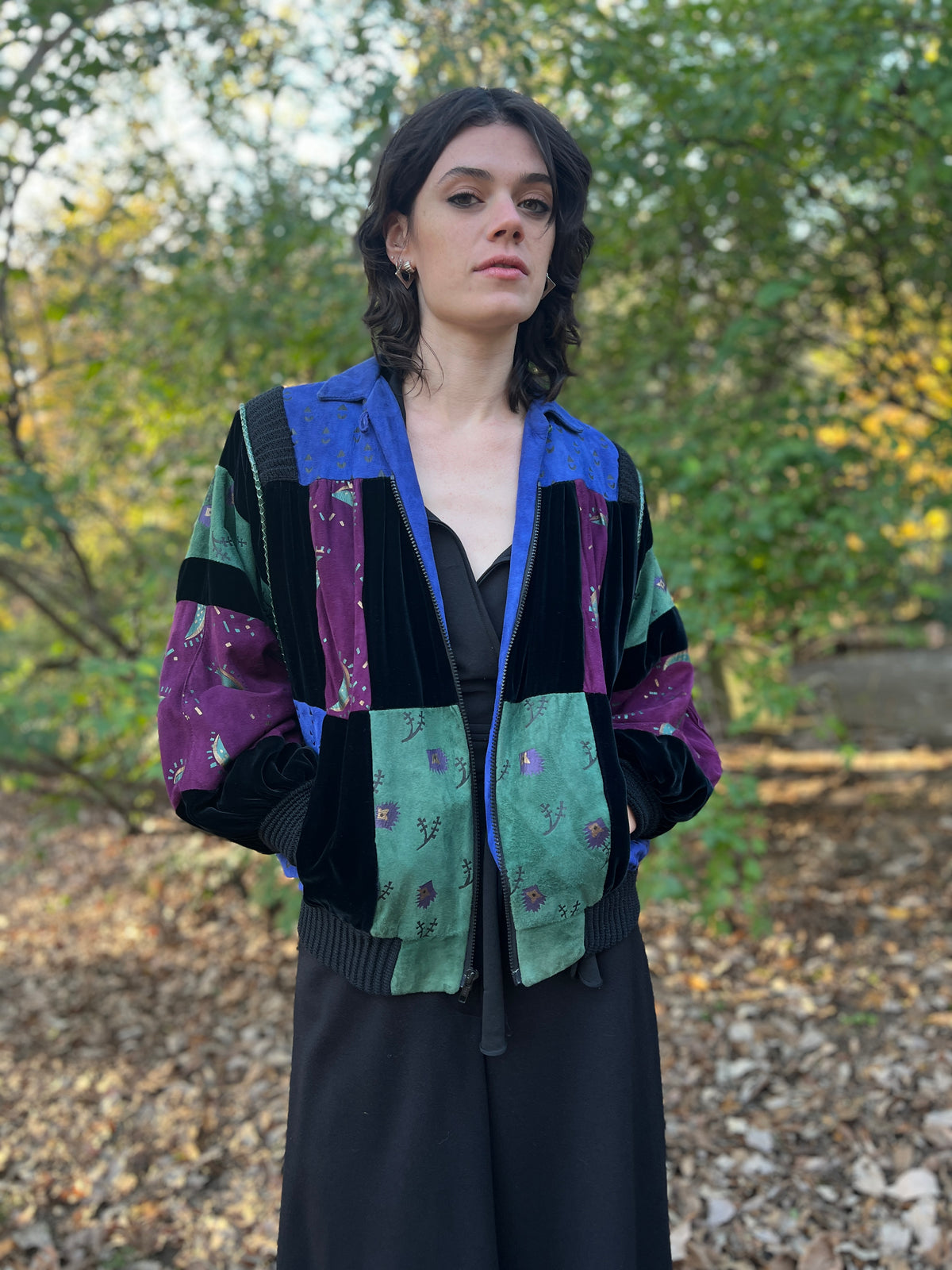 Front view on the model with the zipper open, showing the lapels and suede patches