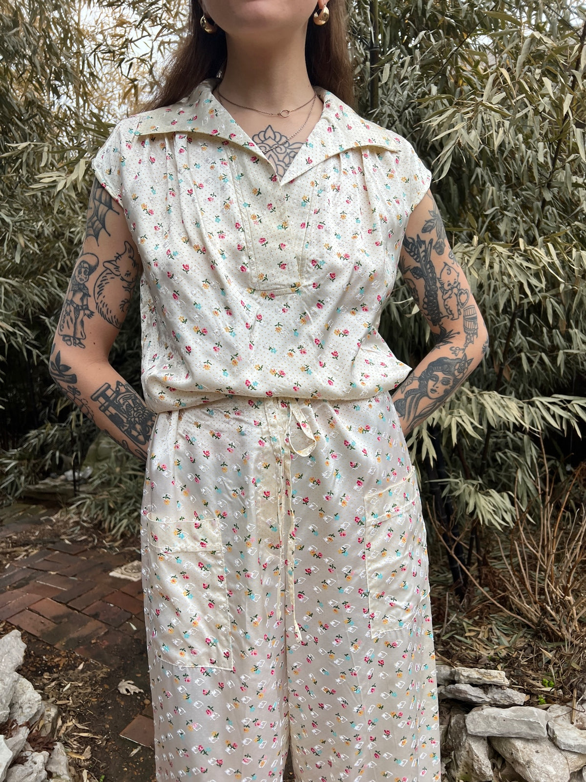 Close-up of the pajama top on the model showing the collar and buttons, plus the pants drawstring and pockets