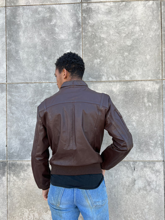 Back view on the model showing the collar and ribbed knit waistband