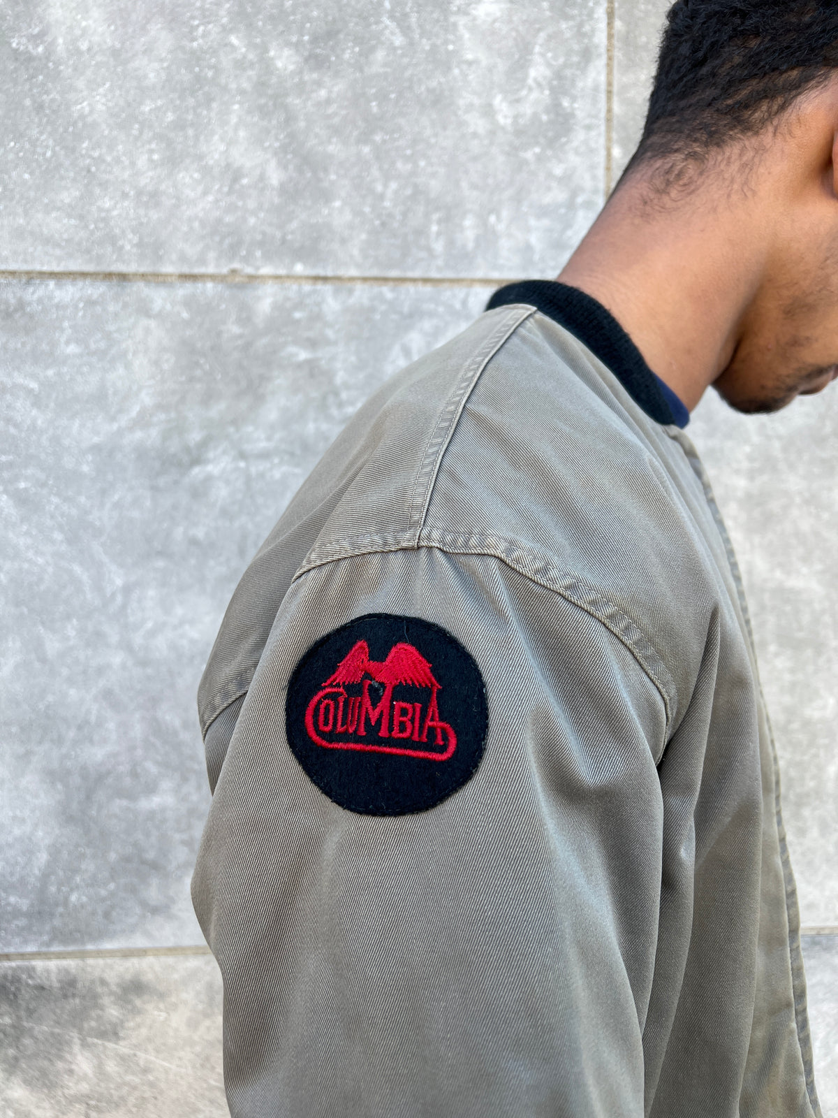 Close-up of the round Columbia patch on the sleeve