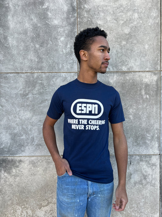 Angled front view on the model showing the ESPN print on the navy tee