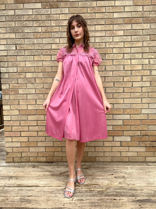 Matching pink robe buttoned at the top over the gown, with sheer sleeves and lace trim