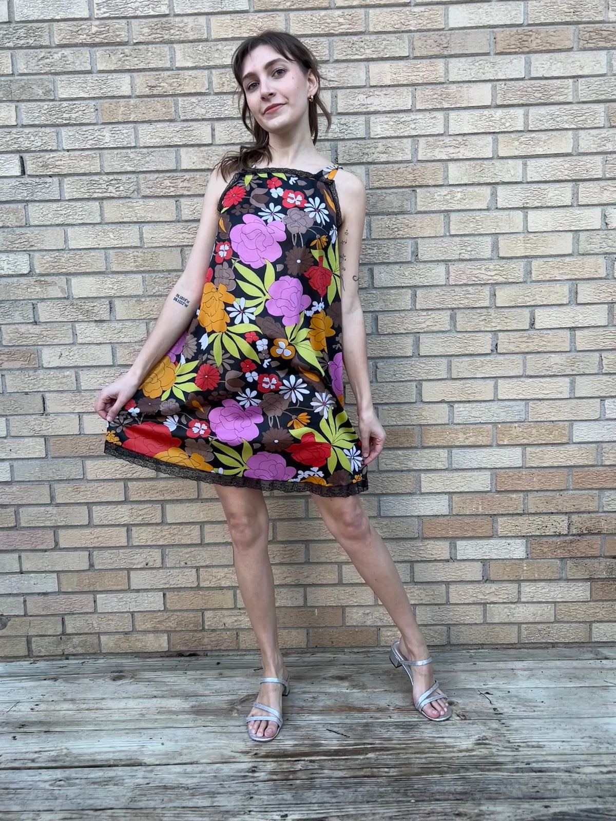 Short nylon nightgown with a floral print on black and black lace trim, worn by a model