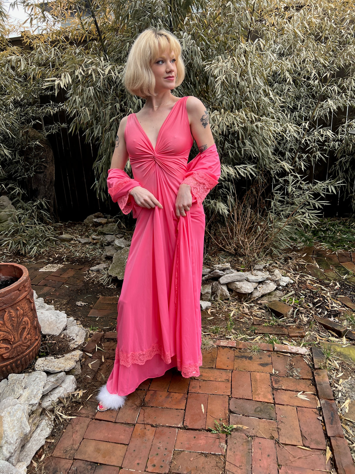 Another view of the gown with its twisted bodice, robe off the shoulders, on the model