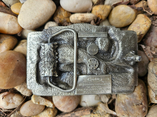 Back of the belt buckle showing the belt loop and the copyright and trademark plates