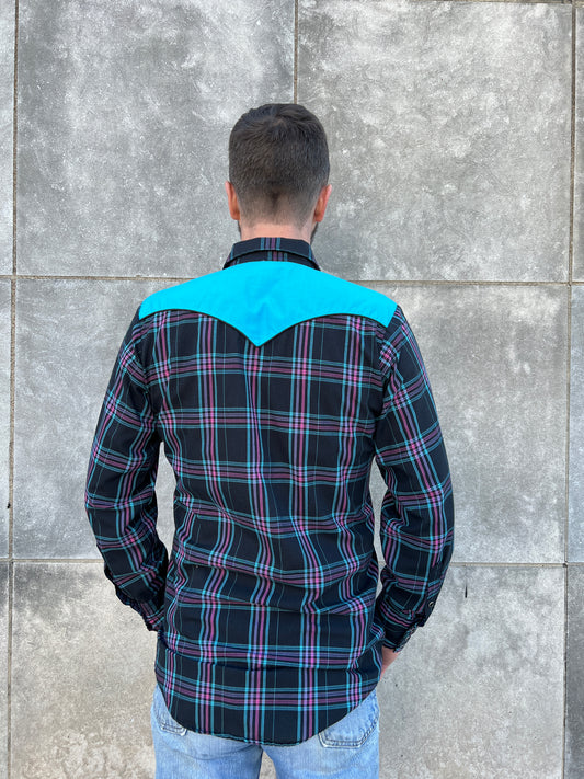 Back view on the model showing the turquoise pointed back yoke and the plaid back