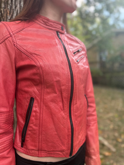 Angled front view showing the center zipper, chest zip pockets and the side zip pocket