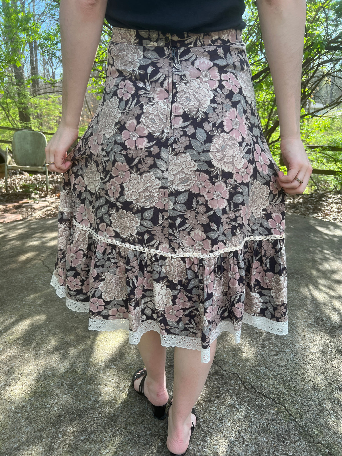 Back view on the model showing the rear zipper, crocheted trim and eyelet hem
