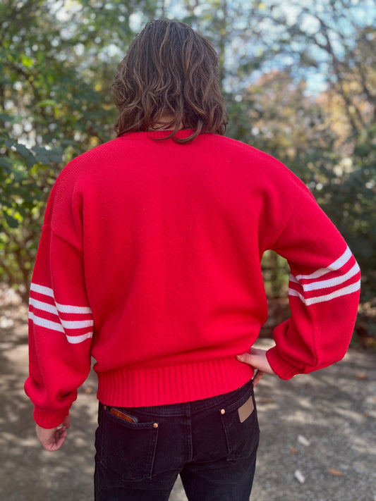 Back view on the model showing the red back, ribbed hem and stripes on each sleeve