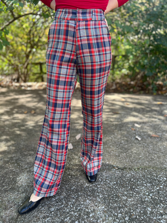 Red and blue plaid bell bottom pants with wide belt loops, worn by a model