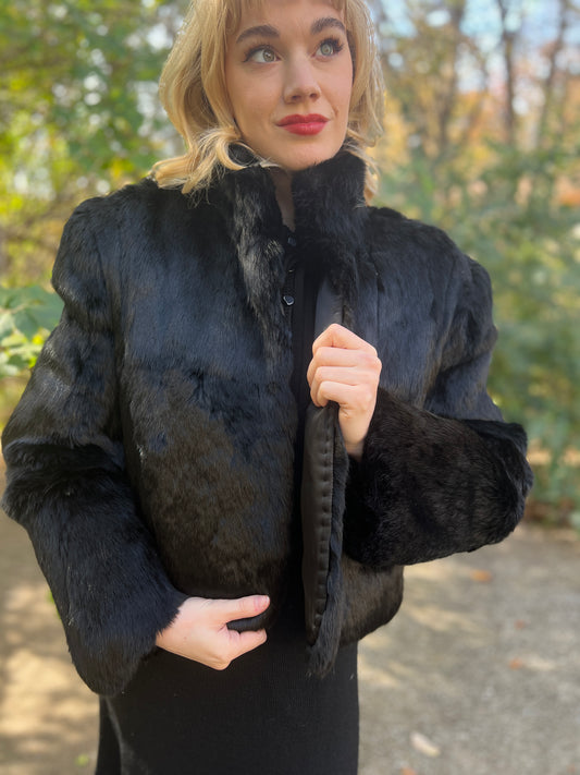 Closer front view on the model showing the fur collar, shoulders and fur sleeves