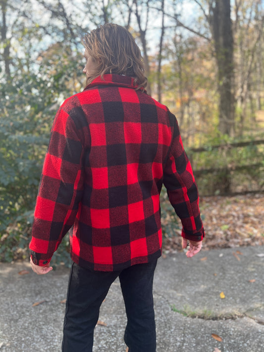 Back view on the model showing the black and red plaid across the back and sleeves