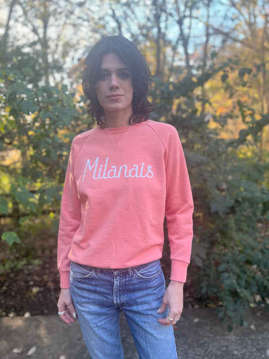 Front view on the model with the sweatshirt over jeans, cuffs and hem visible