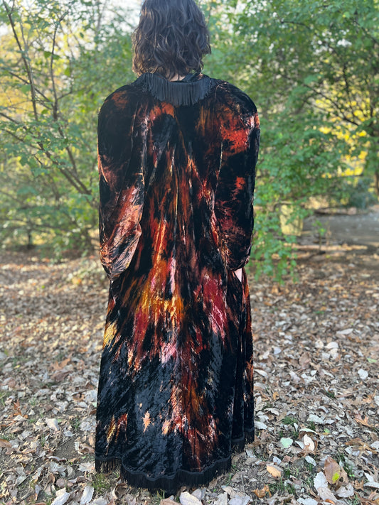 Back view on the model showing the fringe across the back of the collar and the streaked velvet
