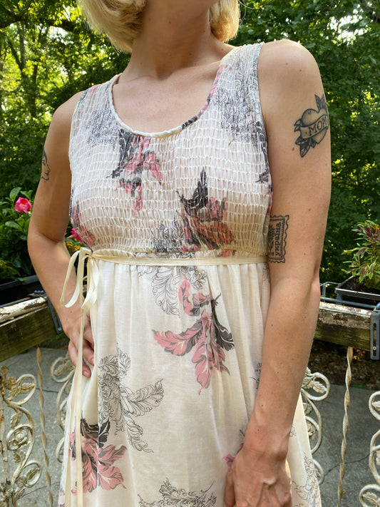 Close-up of the smocked bodice and tiny belt at the waist on the model