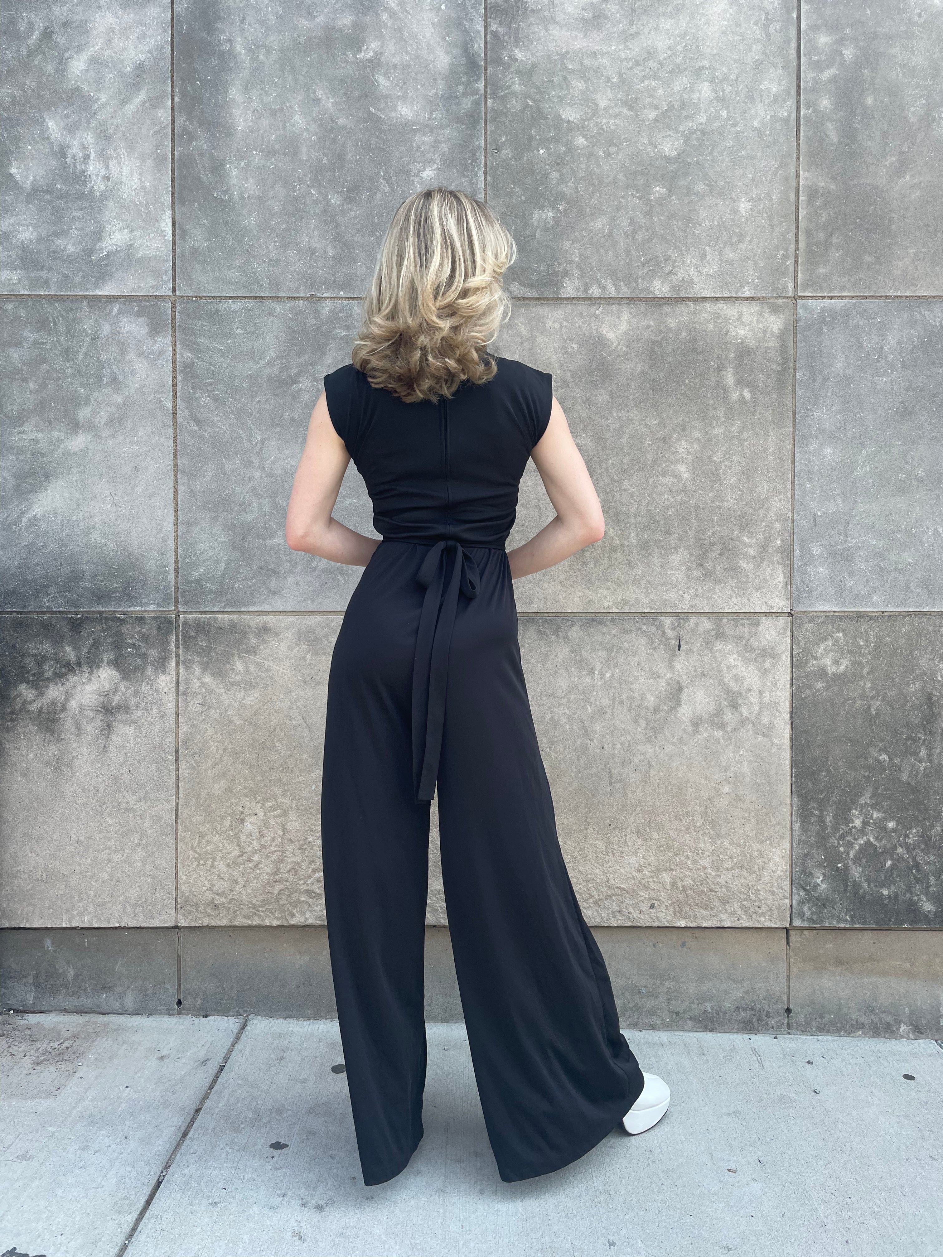 Sleeveless Smocked Jumpsuit With V-Neckline In Black | Adrianna Papell