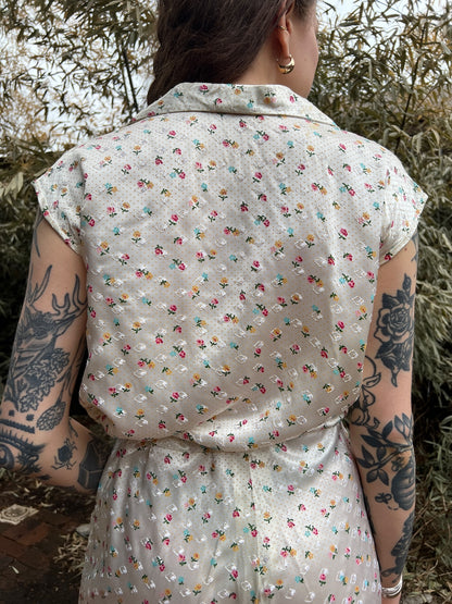 Close-up of the back of the pajama top on the model showing the small floral pattern