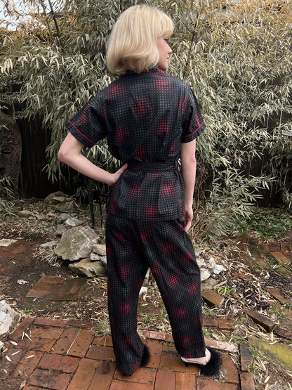 Back view on the model showing the pajama top, belt and straight-leg pants