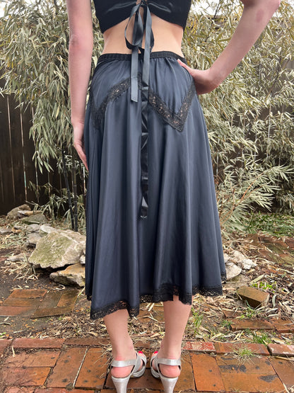 Back view of the slip on the model showing the lace at the hips