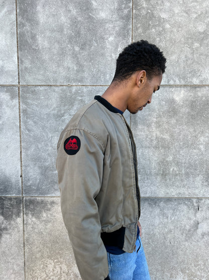 Side view on the model showing a round Columbia patch on the upper sleeve