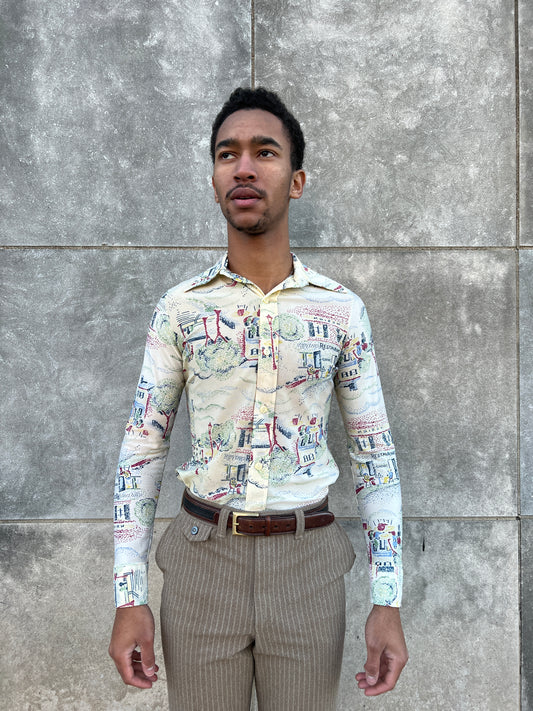 Long sleeve nylon shirt with a big butterfly collar and a cafe and park scene print, worn by a model
