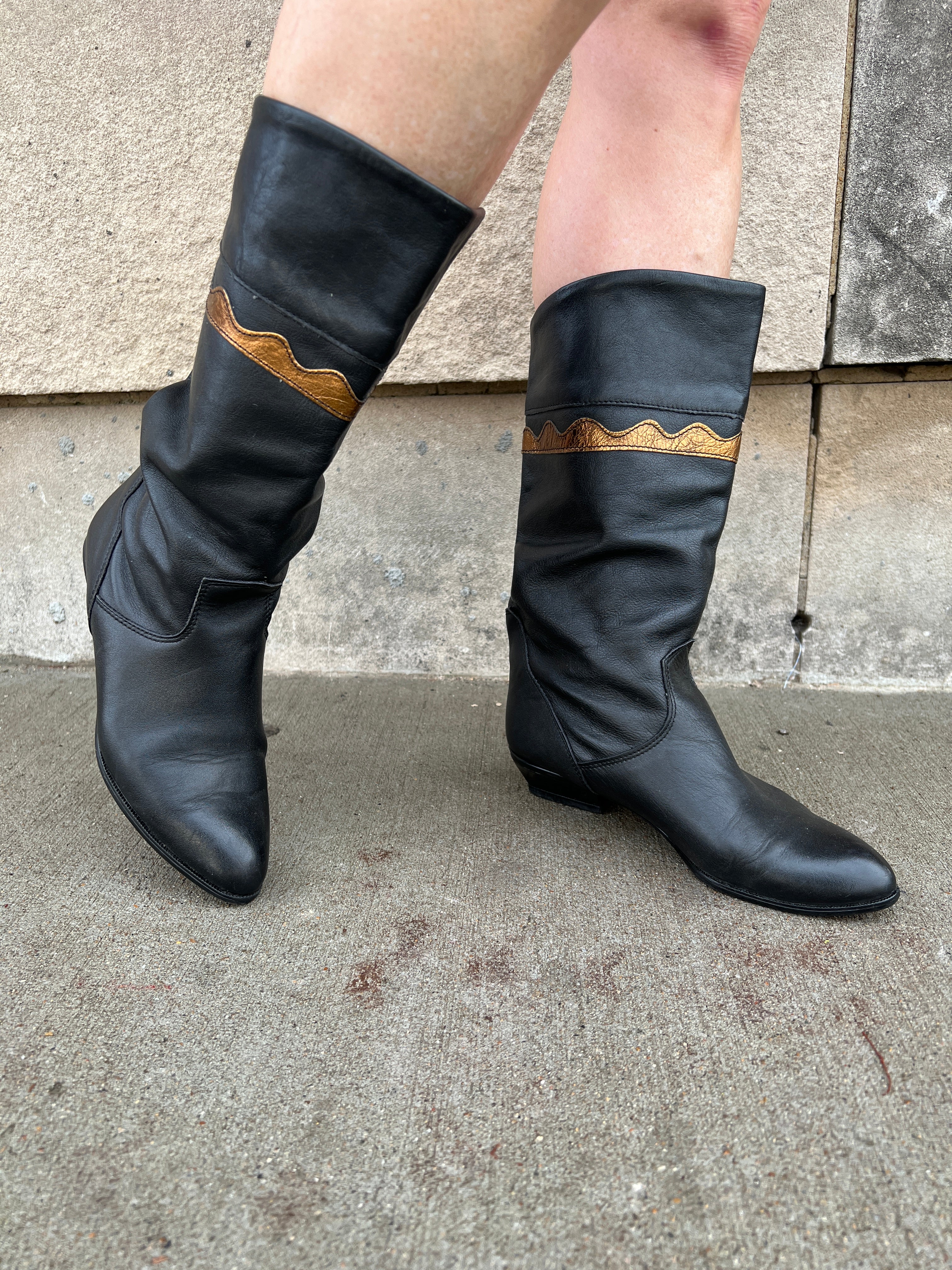 Black boots with brown trim sale