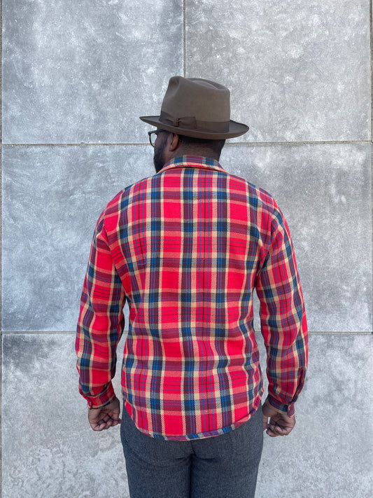 Back view on the model showing the plaid across the back, collar and sleeves
