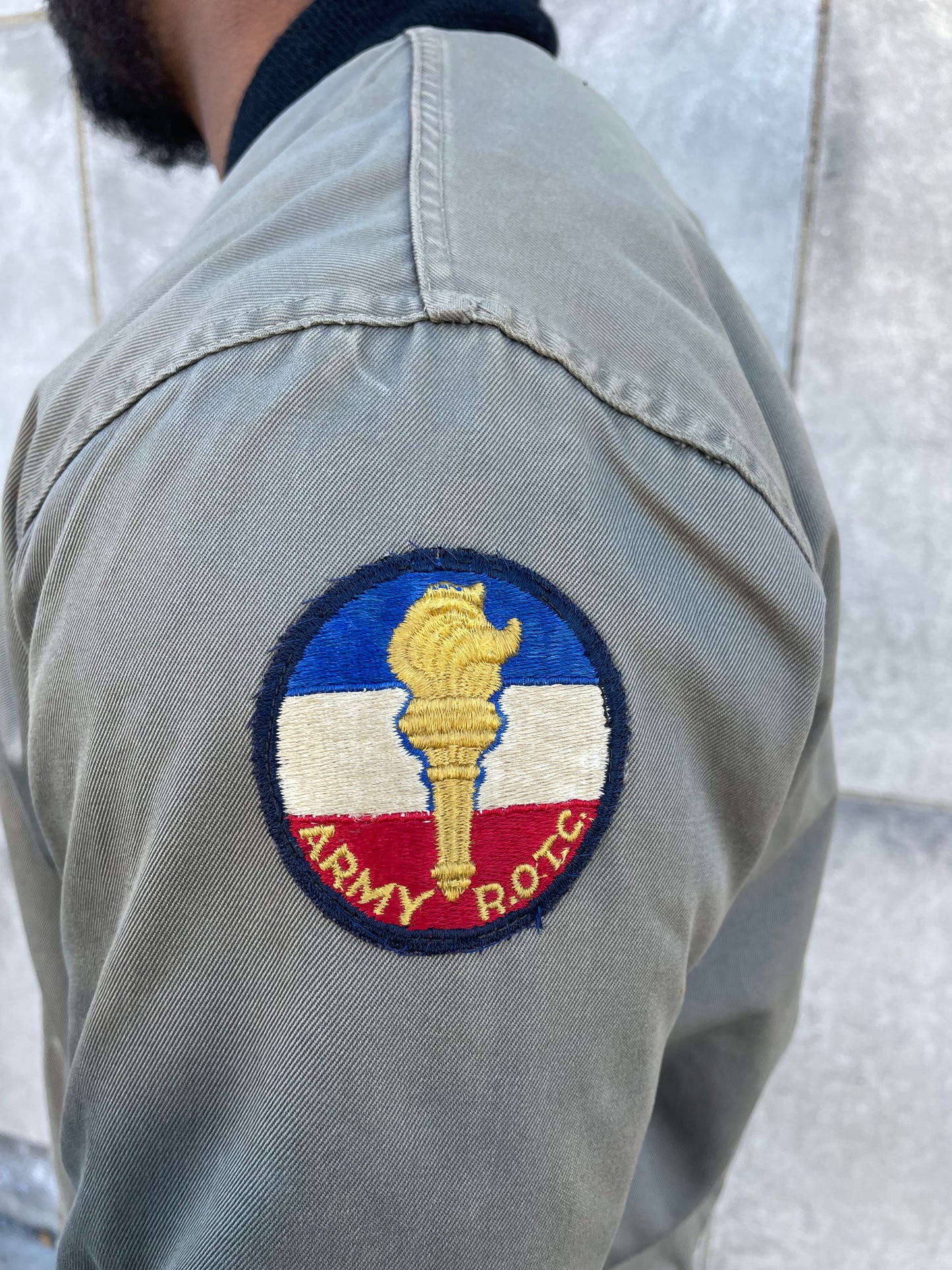 Close-up of the round ROTC patch on the sleeve